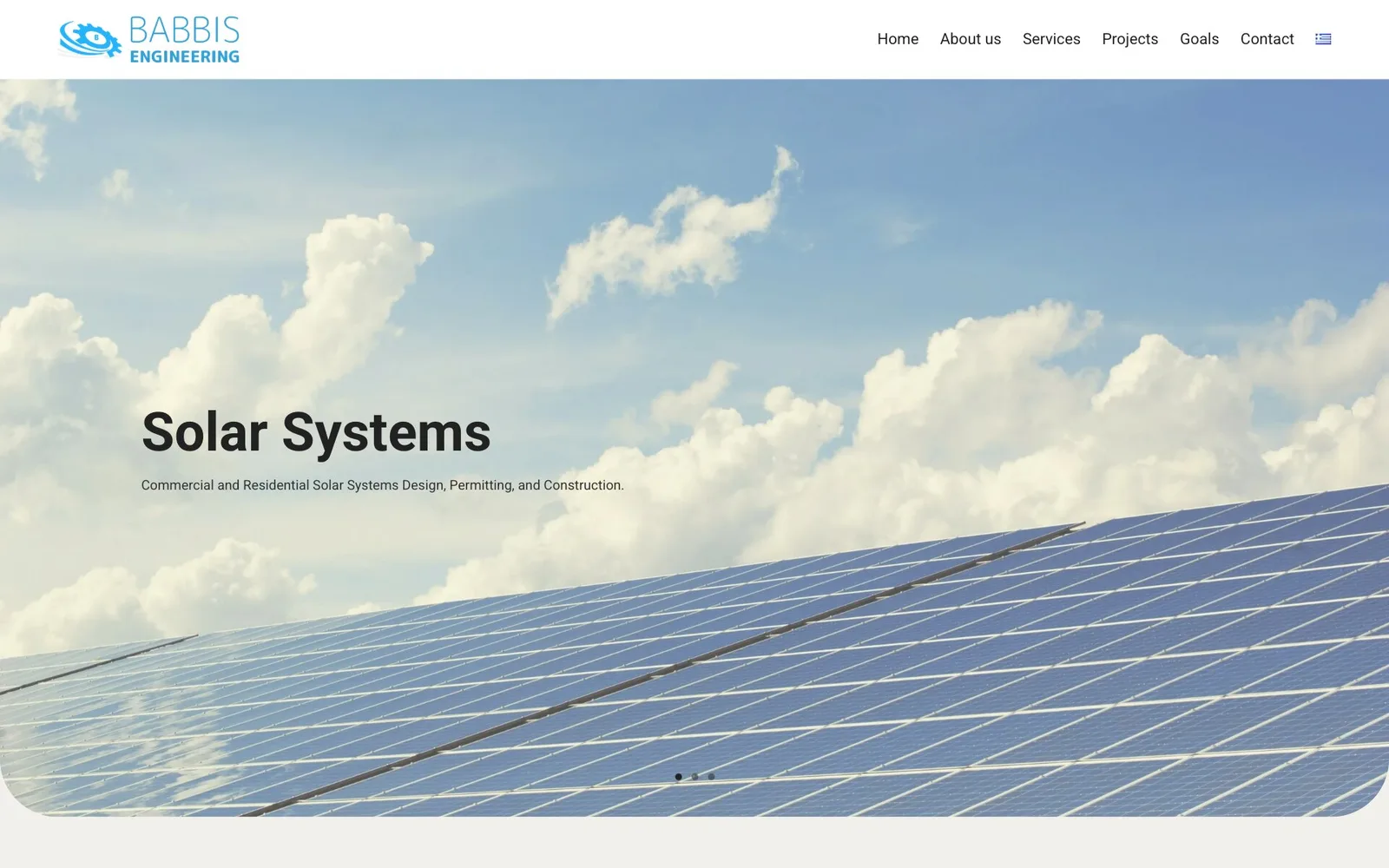 The Babbis Engineering home page in English: the blue logo of a gear with a swoosh and the menu Home, About us, Services, Projects, Goals and Contact with a Greek flag; over a photograph of rows of solar panels under a blue sky with white clouds, its lower corners rounded, the heading "Solar Systems", the line "Commercial and Residential Solar Systems Design, Permitting, and Construction." and three slide dots at the bottom.