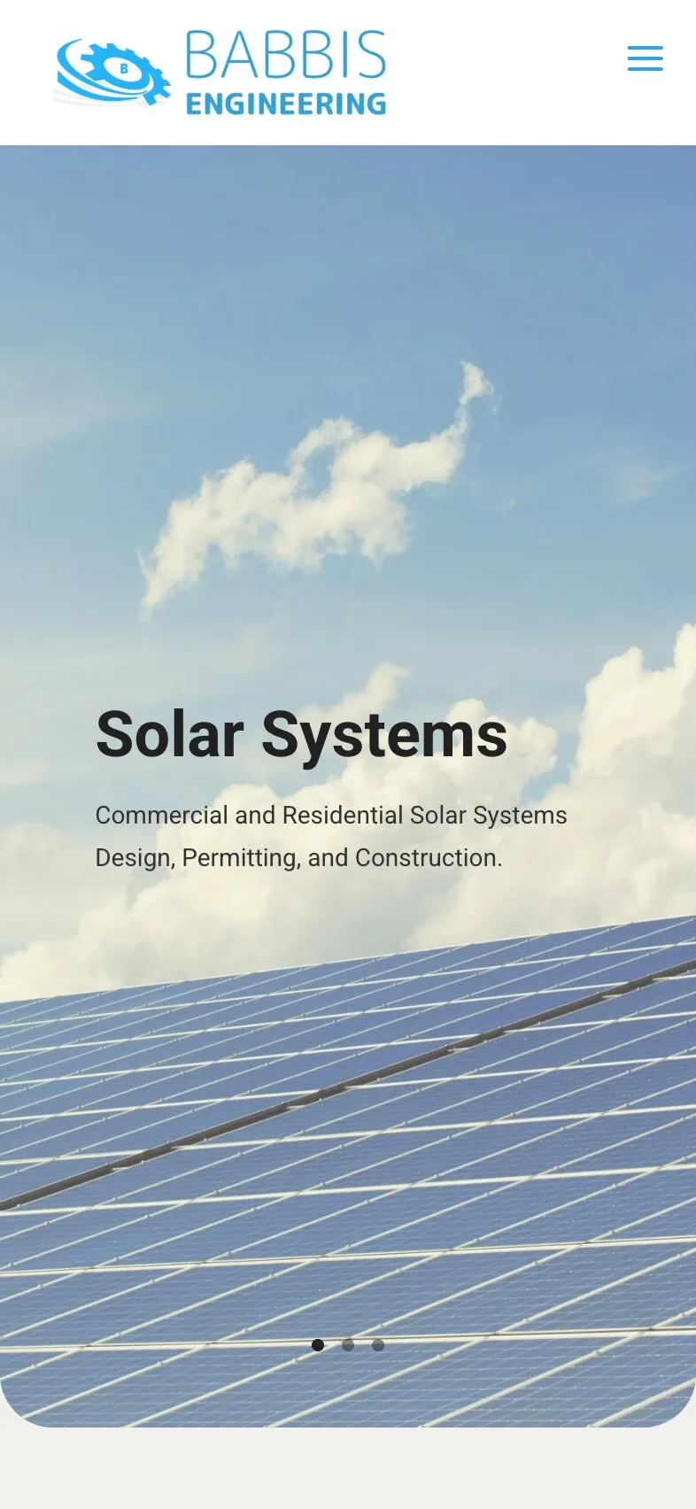 The home page on a phone: the logo and a menu button, the solar-panel photograph with the heading "Solar Systems" and the line about commercial and residential design, permitting and construction over two lines, and three slide dots near its rounded bottom edge.