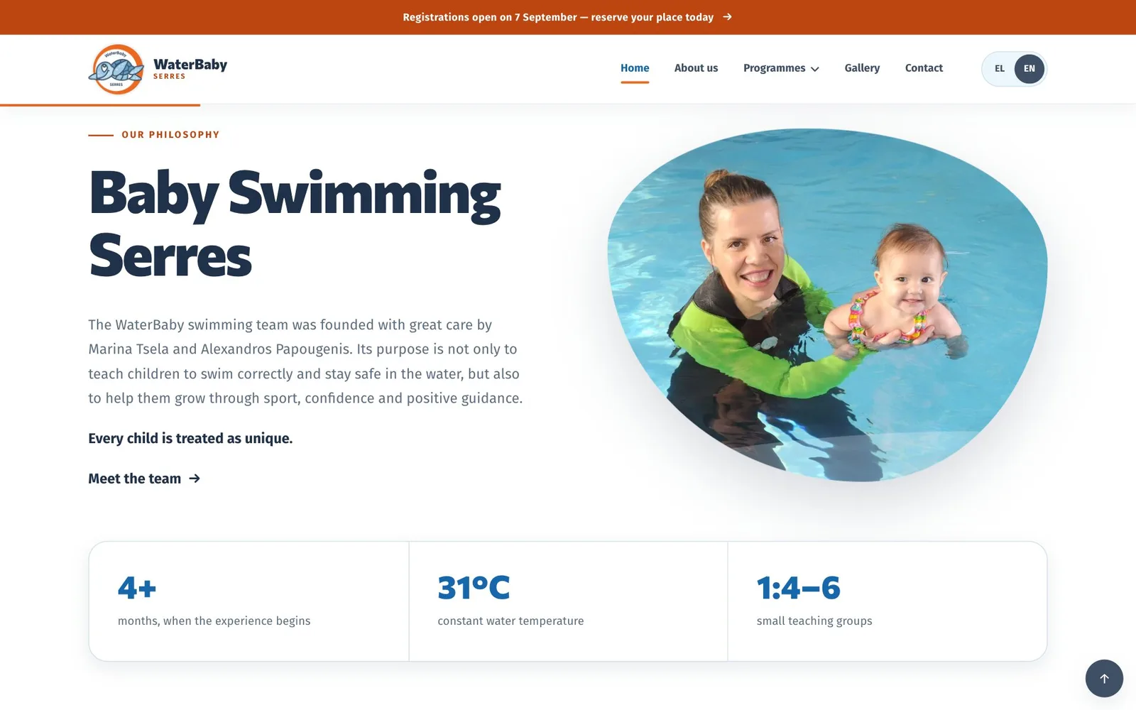 The section “Baby Swimming Serres” under the label “Our philosophy”: a paragraph naming the team’s two founders, the bold line “Every child is treated as unique.” and a “Meet the team” link, beside a rounded, organic-shaped photograph of a smiling adult in a black and green wetsuit holding up a smiling baby in the pool, above a strip of three figures: 4+ months when the experience begins, 31°C water temperature and 1:4–6 teaching groups.