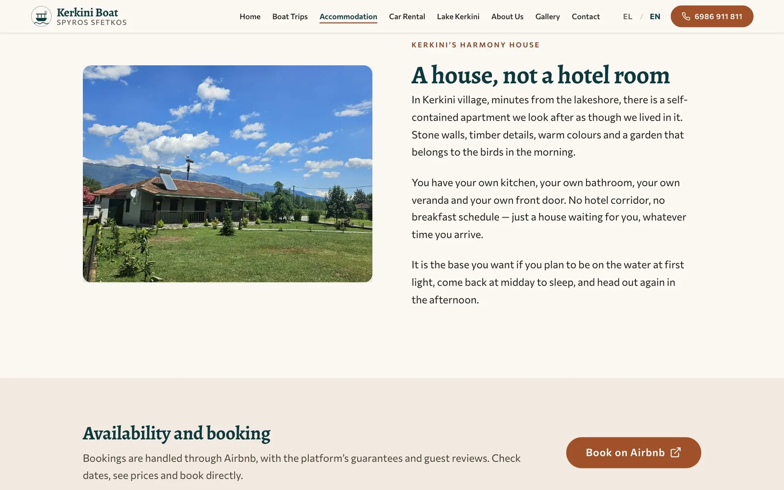The accommodation page: the label "Kerkini's Harmony House" and the heading "A house, not a hotel room" beside a photograph of a single-storey house with a tiled roof, a solar water heater and a veranda, on a wide lawn under a blue sky with mountains behind, followed by three paragraphs; below, a band headed "Availability and booking" explaining that bookings go through Airbnb, with a rust "Book on Airbnb" button.