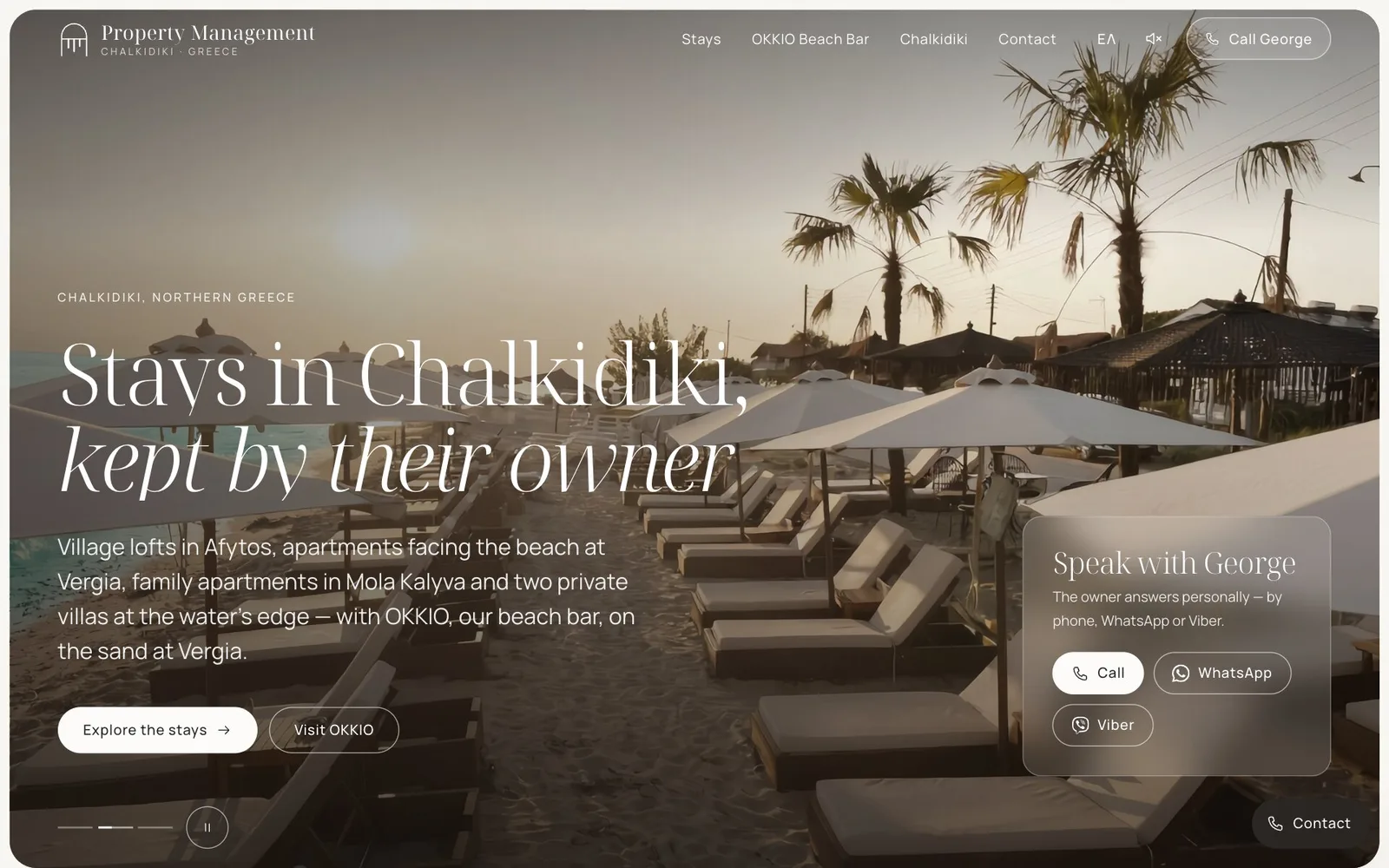 The Property Management home page: under the line "Chalkidiki, Northern Greece", the headline "Stays in Chalkidiki, kept by their owner", its second line in italic, over a photograph of sunbeds and fringed parasols on a palm-lined beach at sunset; below it a short introduction with the buttons "Explore the stays" and "Visit OKKIO", and on the right a translucent card, "Speak with George", with Call, WhatsApp and Viber buttons.